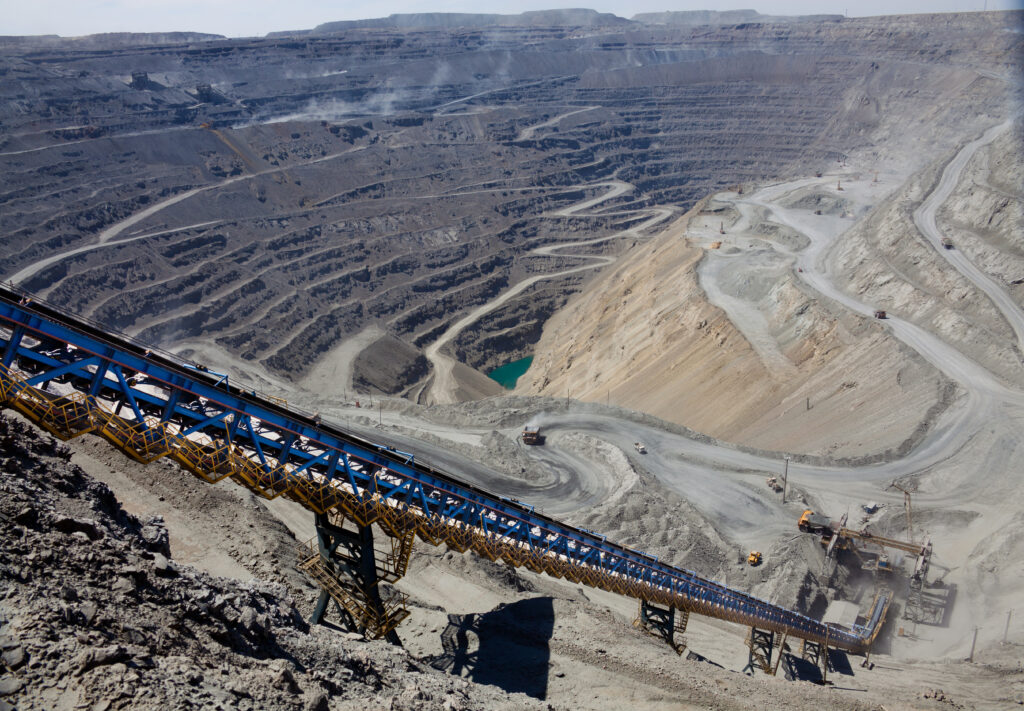Ore conveyor in open pit mining, RobST (Shutterstock)
